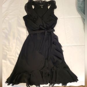 Black wrap dress with ruffles and tie at waist